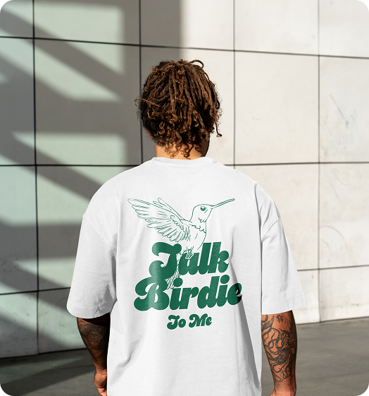 A man wearing a Talk Birdie To Me t-shirt