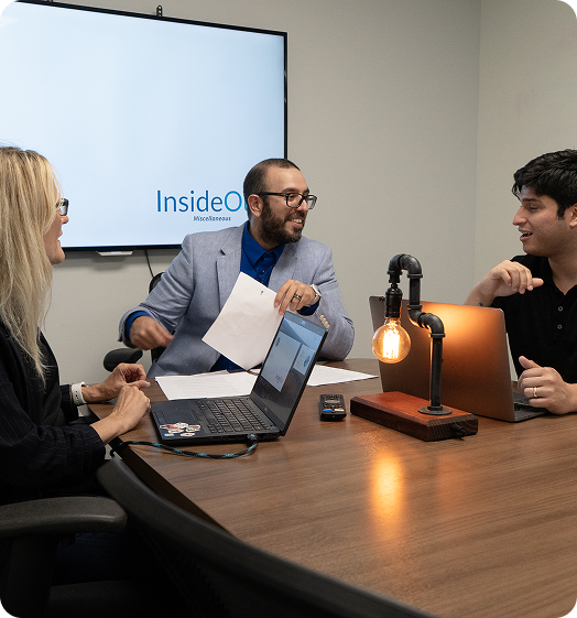 A group of people in a business meeting